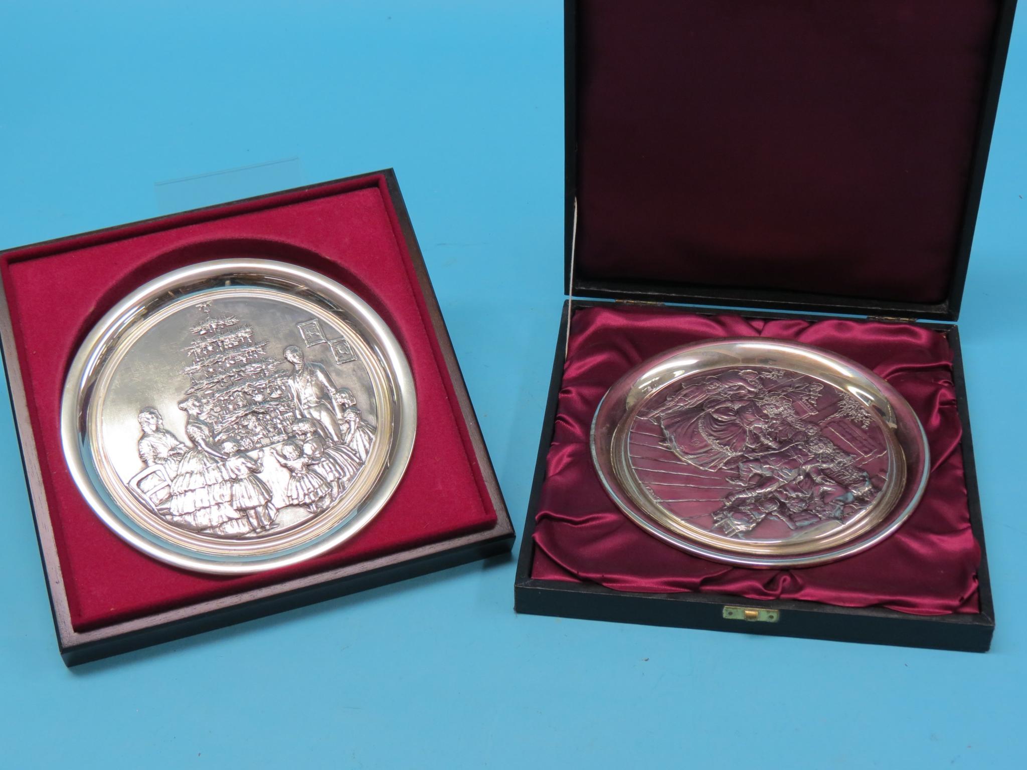 Appraisal: Two silver Birmingham Mint Christmas Plates embossed interior scenes after