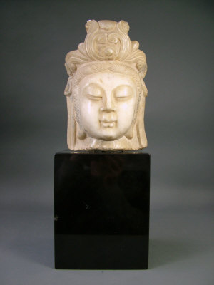 Appraisal: A Chinese white marble Qing style head of a deity