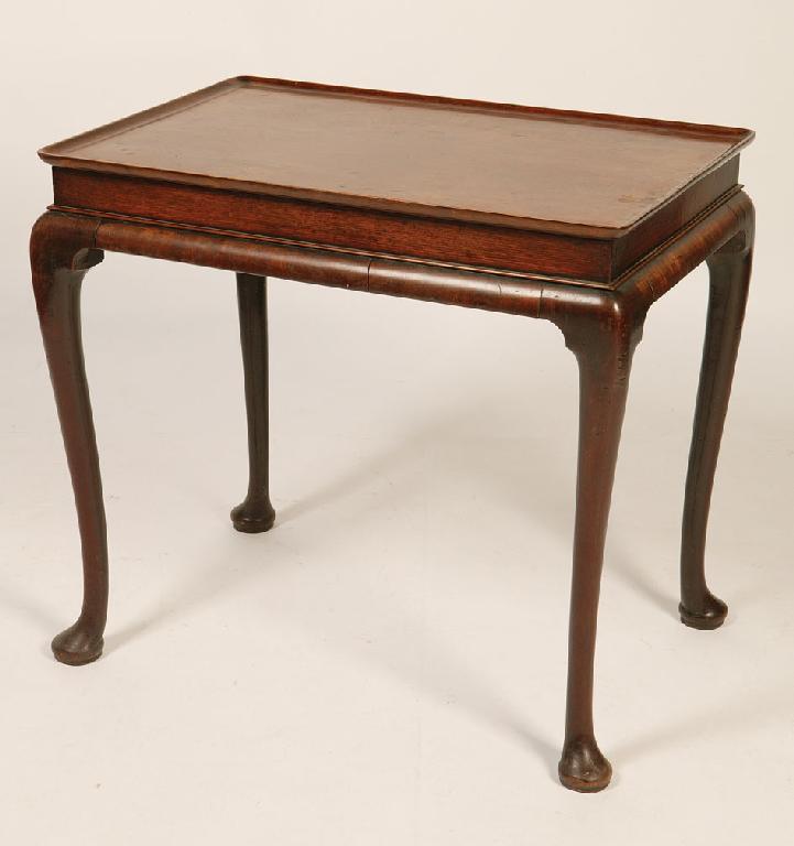 Appraisal: A GEORGE I WALNUT SILVER TABLE with a dished rectangular