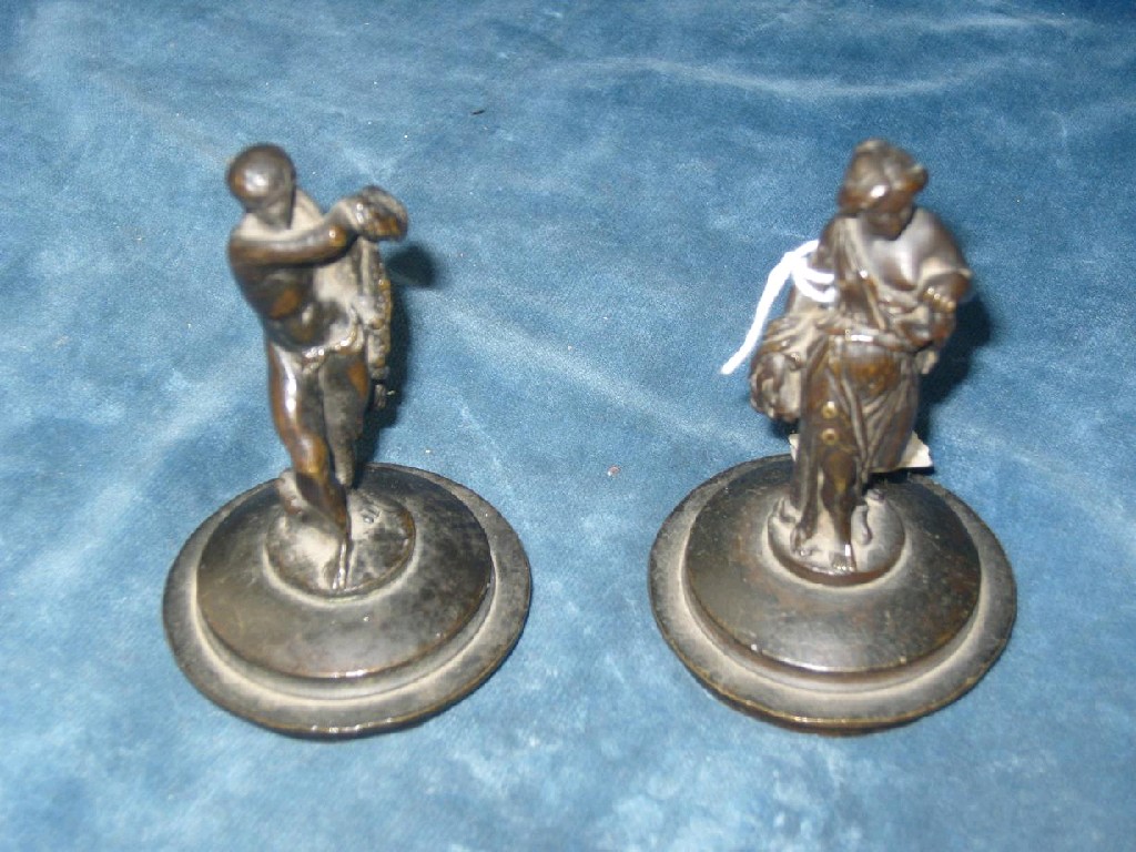 Appraisal: A pair of th century cast bronze figures of male