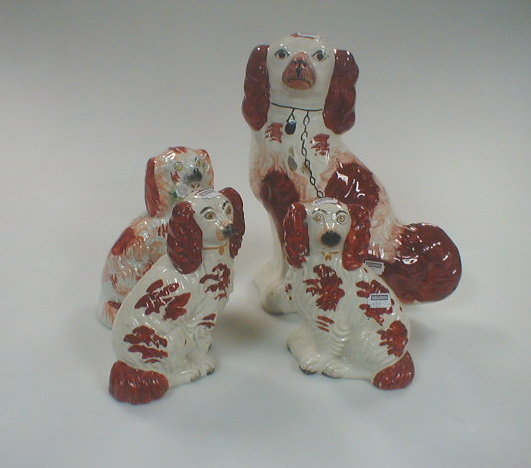 Appraisal: A pair and two other Victorian Staffordshire Spaniels with liver