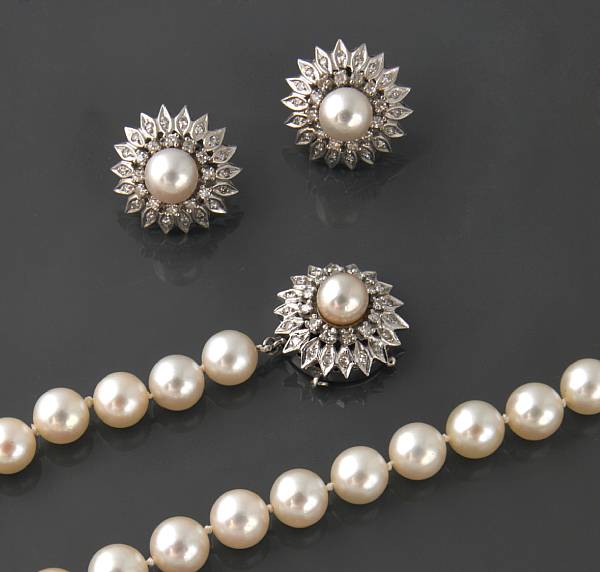 Appraisal: A strand of cultured pearls with a diamond and k