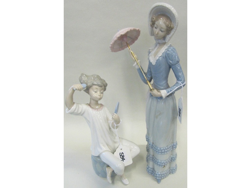 Appraisal: Two Lladro figures of a lady with a parasol and