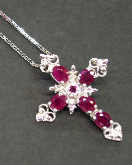 Appraisal: Fourteen-Karat White Gold and Ruby Cross Pendant and Chain the