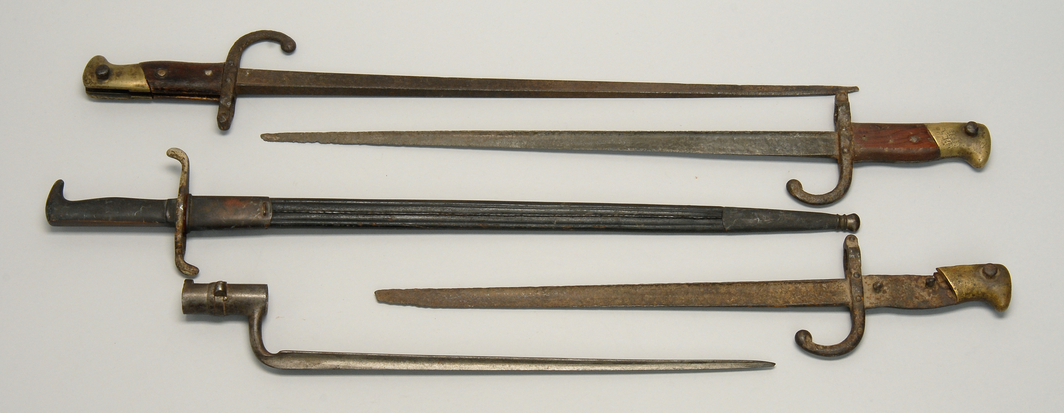 Appraisal: FIVE EUROPEAN BAYONETS th CenturyOne includes scabbard Length of blades