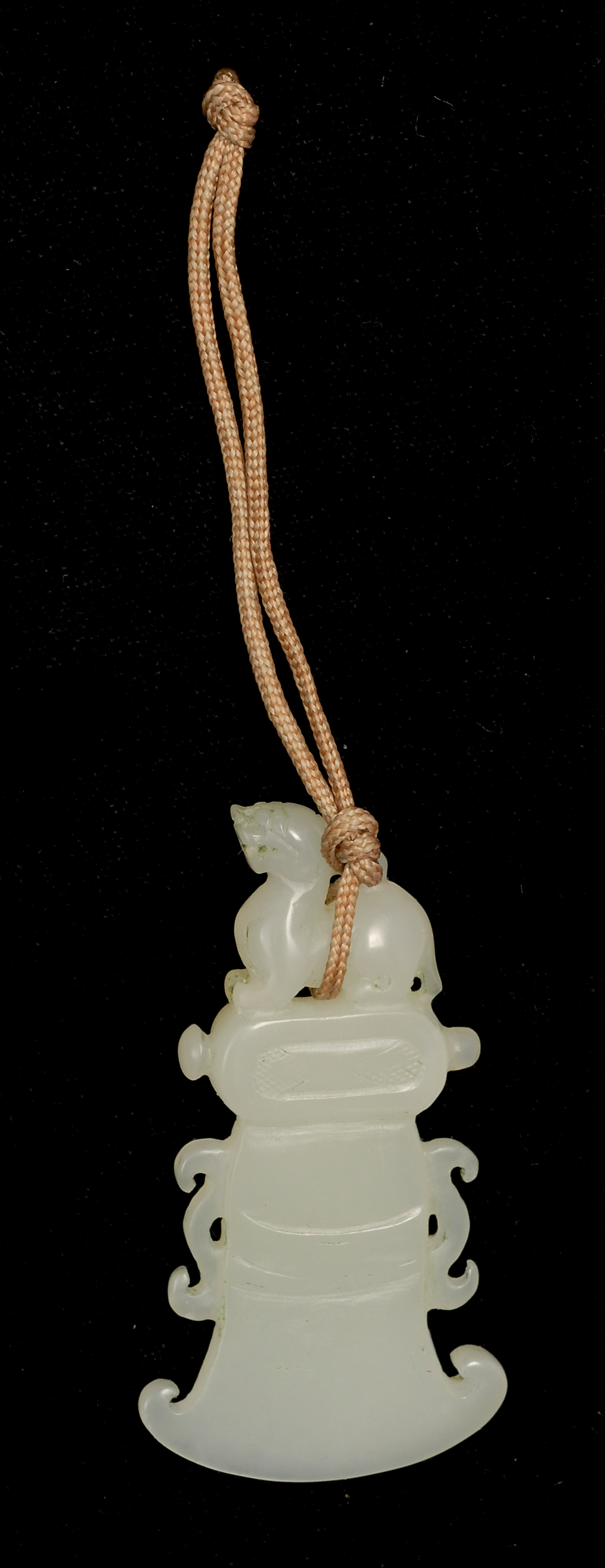 Appraisal: WHITE JADE PENDANT In axe-head form with qilin finial Length