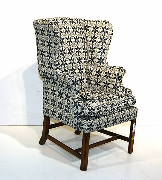 Appraisal: A Chippendale style mahogany wing chair th century height in