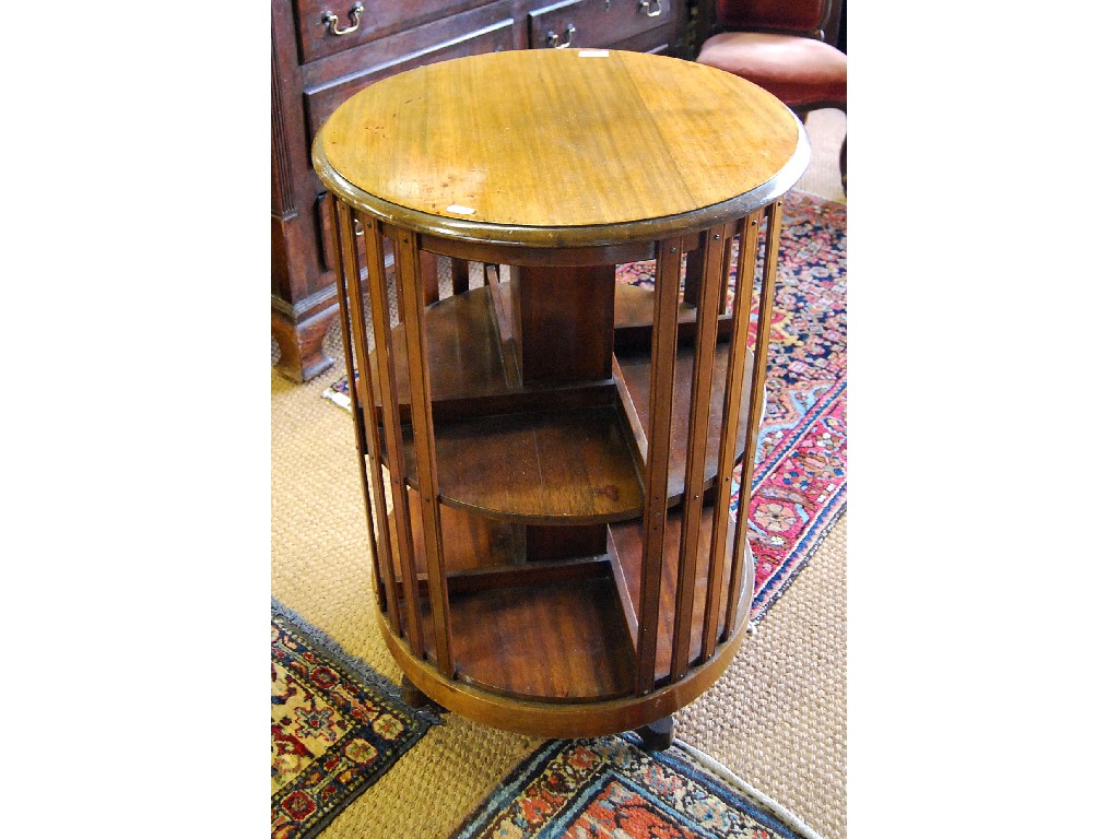 Appraisal: A mahogany revolving bookcase the two tiers having four compartments