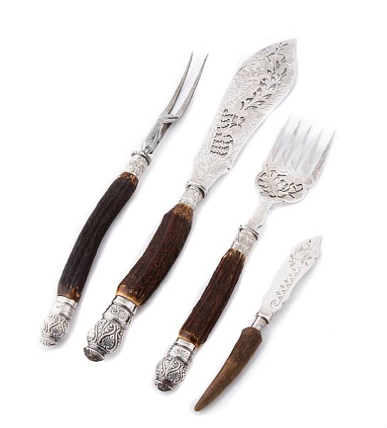 Appraisal: A Victorian seven piece carving set with antler handles with