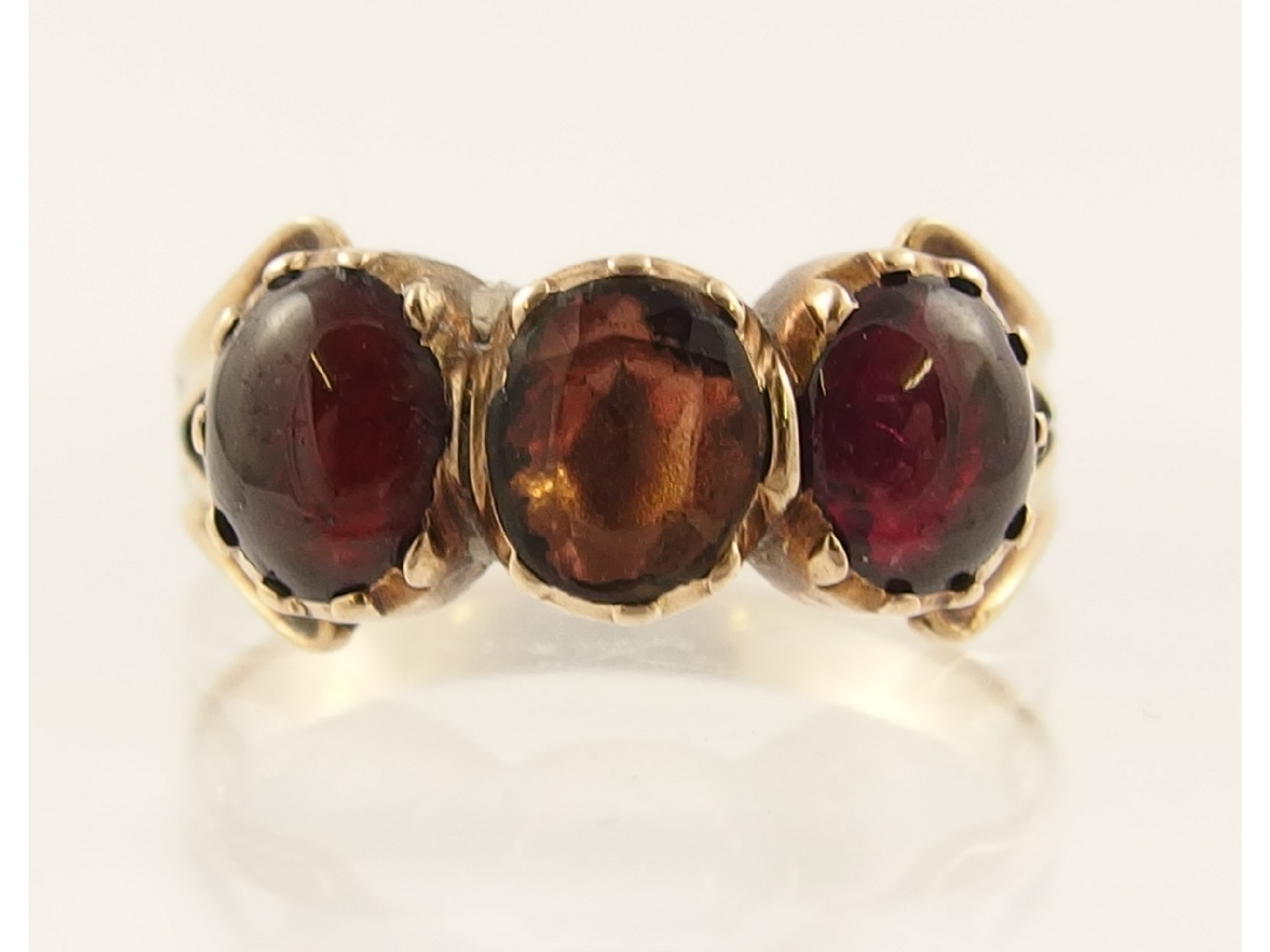 Appraisal: A yellow metal garnet and gem set ring