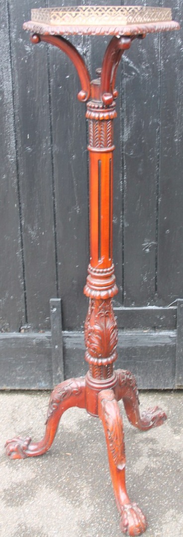 Appraisal: A thC mahogany finish torchere the hexagonal galleried top raised