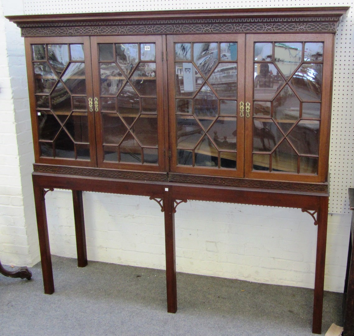 Appraisal: A Chippendale design mahogany double section bookcase on stand cm