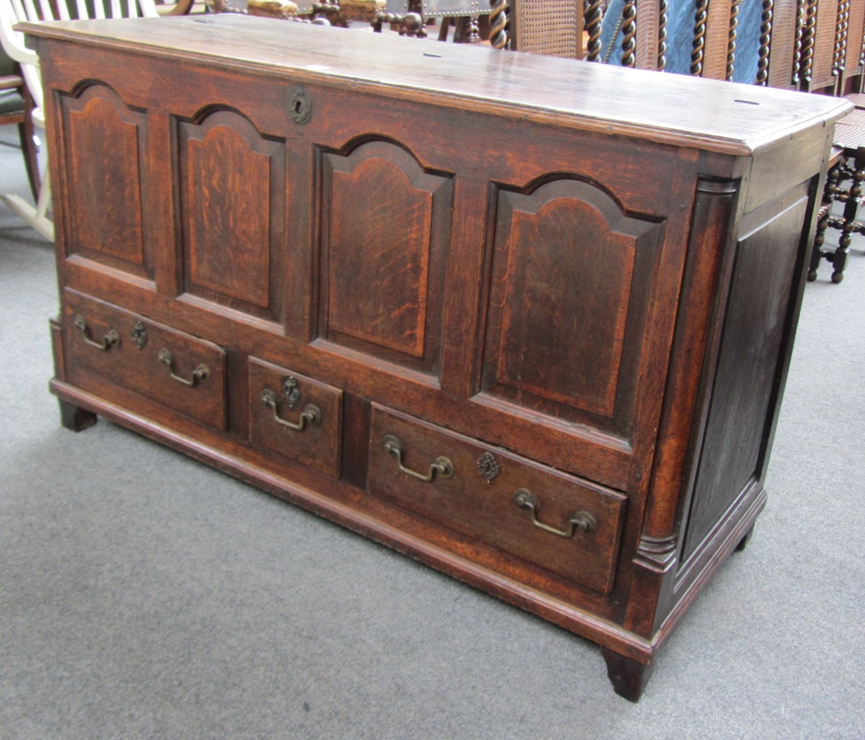 Appraisal: An th century mahogany banded oak mule chest the lift