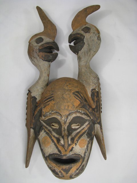 Appraisal: Carved and painted mask with two parrots on either side