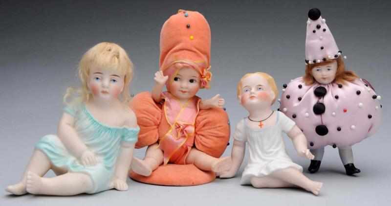 Appraisal: Lot of German All-Bisque Dolls Girl with painted eyes made