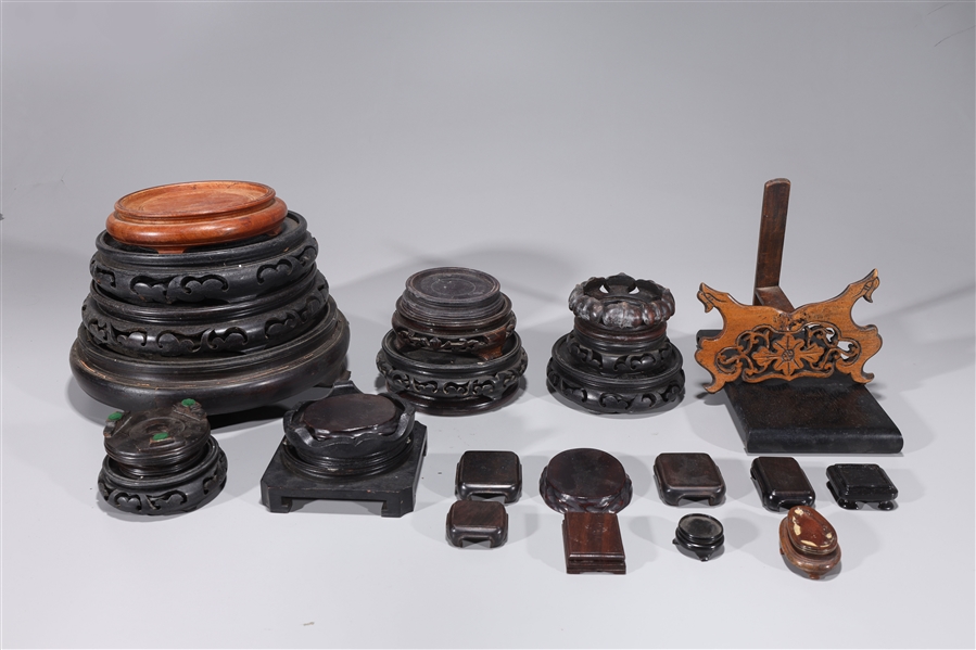 Appraisal: Lot of approximately twenty-five Chinese wooden stands some circular form