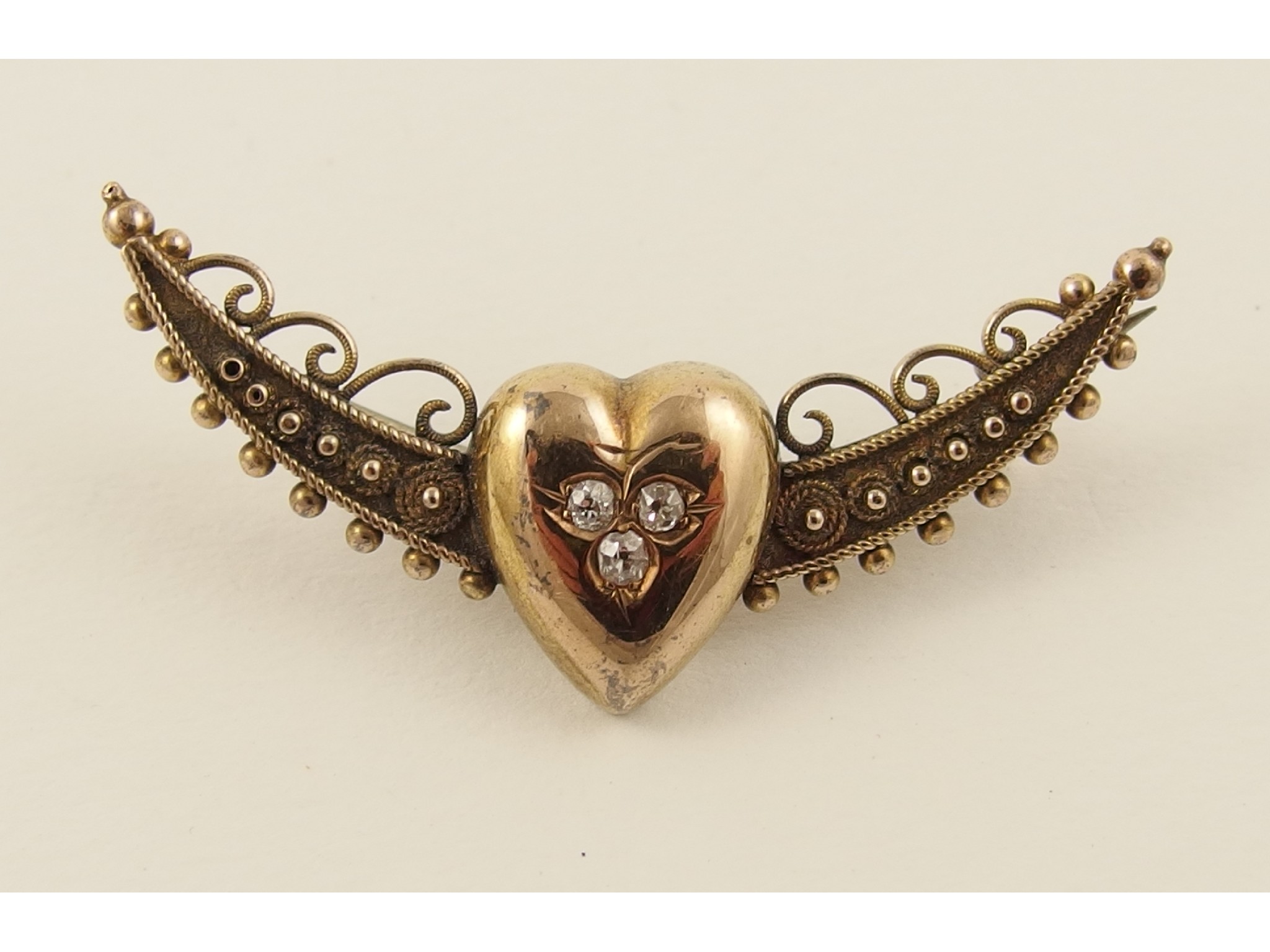 Appraisal: A ct diamond set winged heart brooch