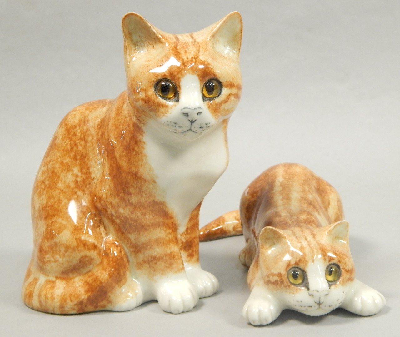 Appraisal: Two similar ceramic cats stamped to underside Mike Clinton England