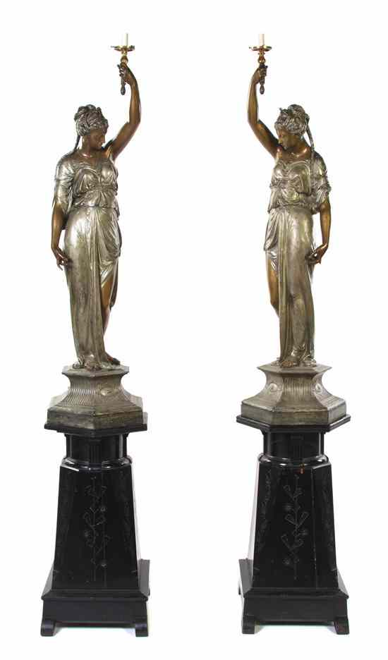 Appraisal: A Pair of Late Victorian Newell Figural Torchieres the draped