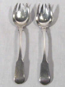 Appraisal: A pair of provincial or colonial silver pickle spoons each