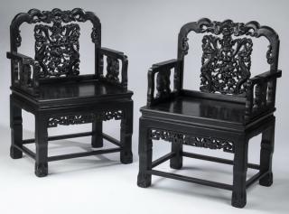 Appraisal: Chinese zitan armchairs carved w qilin h Pair of Chinese