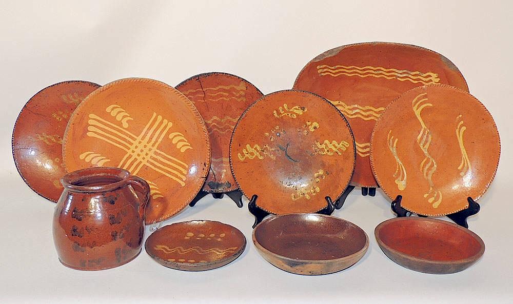 Appraisal: Pieces of Pennsylvania Redware th century Most with slip decoration