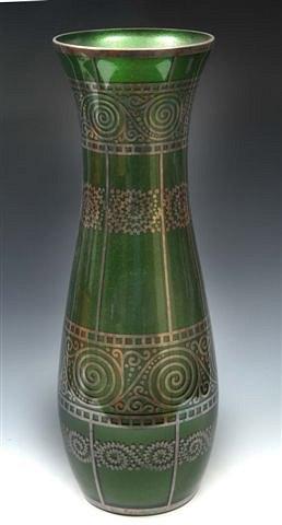 Appraisal: A tall green glass vase of slender baluster form decorated