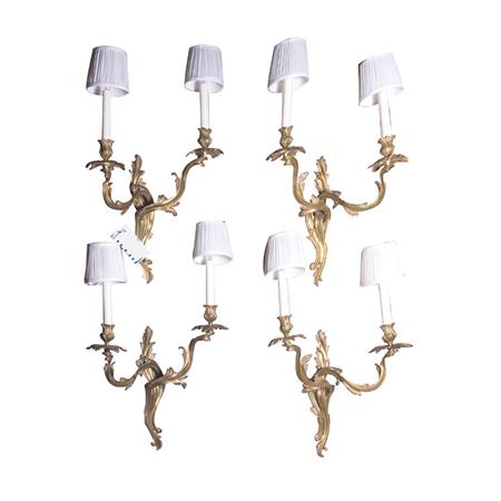 Appraisal: Set of Four Louis XV Style Gilt-Metal Two-Light Sconces Estimate