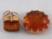 Appraisal: A carat gold honey amber brooch with pendant fitting hallmarked