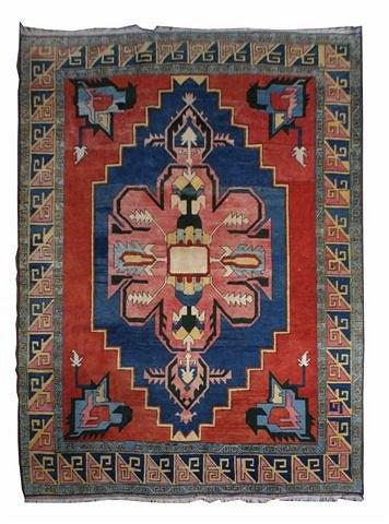 Appraisal: A PERSIAN CARPET woven with Heriz style medallion in colours