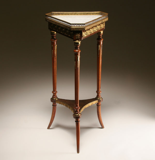 Appraisal: Triangular French stand table with ormolu mounts pierced brass gallery