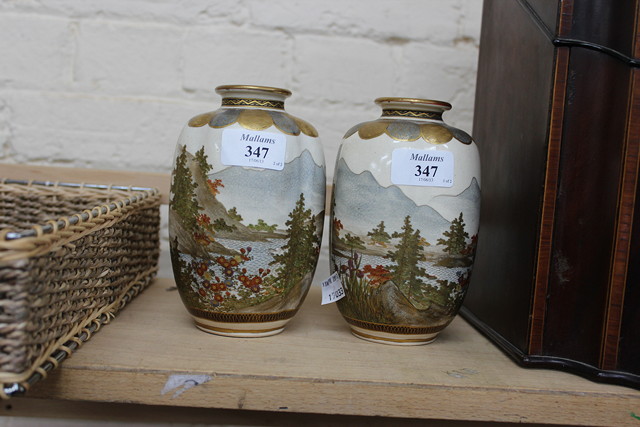 Appraisal: A PAIR OF RIBBED OVOID SATSUMA WARE VASES decorated with