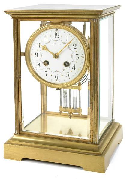 Appraisal: A French gilt brass and four glass mantel clock retailed