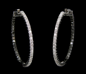 Appraisal: A Pair of Black and White Diamond Hoop Earrings in