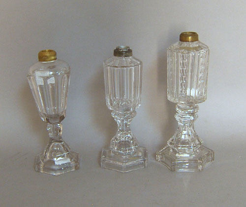 Appraisal: Three colorless glass fluid lamps th c h and h