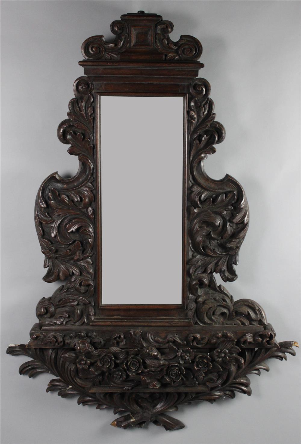 Appraisal: BAROQUE STYLE FOLIATE CARVED MIRROR vertical inset mirror with molding