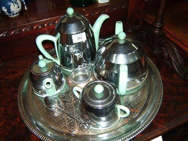 Appraisal: An Art Deco green glazed teaset with plated covers all