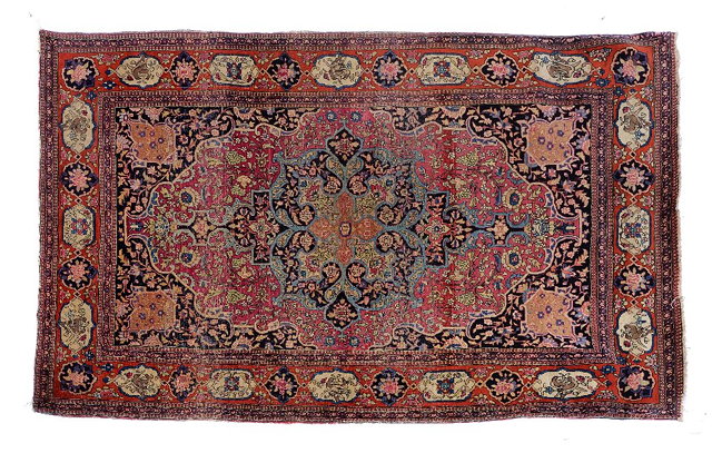 Appraisal: AN ANTIQUE ISFAHAN RUG the central blue ground foliate medallion