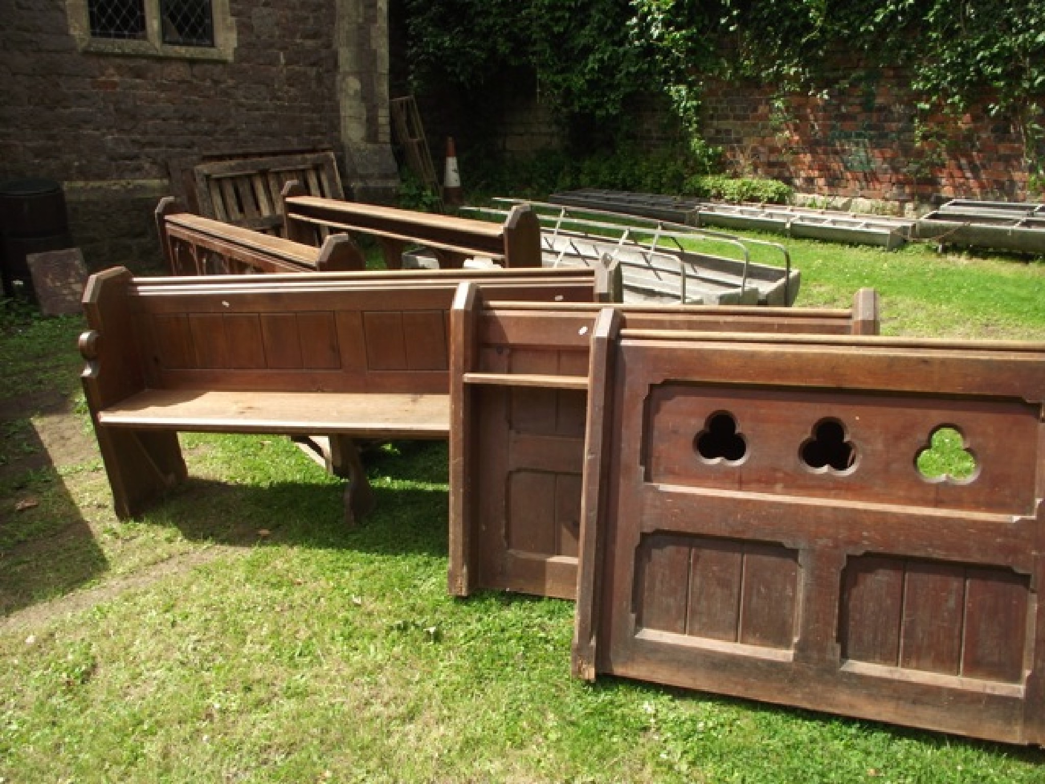 Appraisal: A pair of reclaimed pitch pine church altar rails with