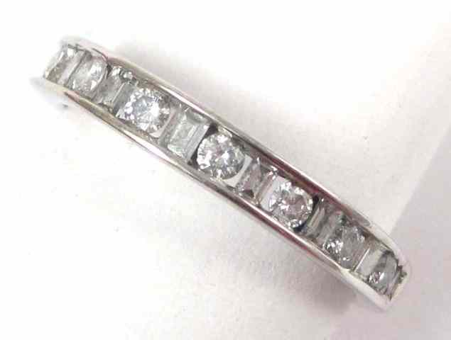 Appraisal: DIAMOND AND FOURTEEN KARAT GOLD RING The white gold band