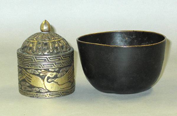 Appraisal: A Tibetan metal covered box gold and silver-damascened dragon decoration