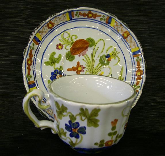 Appraisal: Twenty-One-Piece Polychromed Italian Majolica Set of Teacups and Saucers in