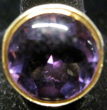 Appraisal: karat yellow gold amethyst ringBezel set round cut amethyst