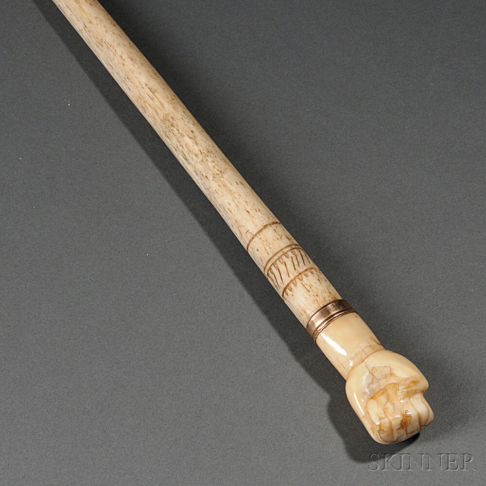 Appraisal: Carved Whalebone Cane America th century the clenched fist knop