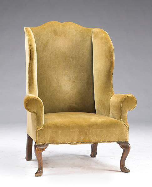 Appraisal: A George III style upholstered wing chair late th early