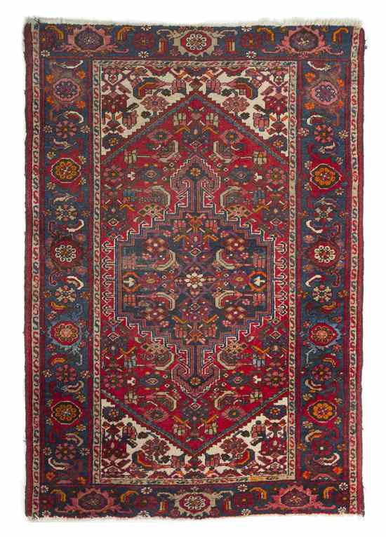 Appraisal: A Northwest Persian Heriz Wool Rug having a geometric center