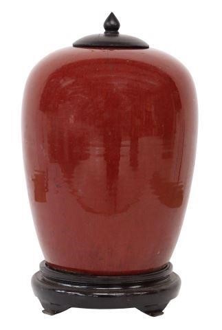 Appraisal: Chinese sang de boeuf oxblood glazed porcelain lidded jar wax