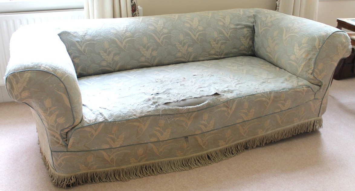 Appraisal: A late Victorian Chesterfield sofa with turned and raised feet