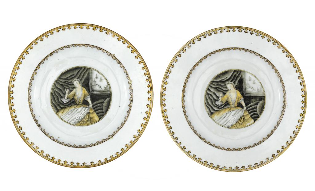 Appraisal: A PAIR OF GRISAILLE AND GILT 'SEAMSTRESS' PLATES finely painted