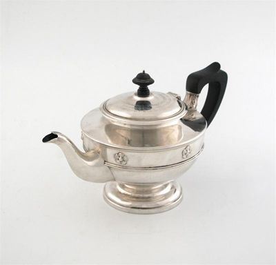 Appraisal: An Edwardian circular teapot with a pedestal foot and two